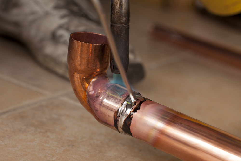 Soldering,Copper,Pipes,With,Tin,And,Torch