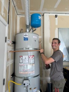 Technician working on water heater