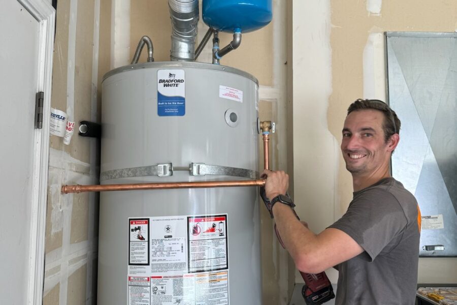 Technician working on water heater