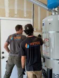 Workers Working on Hot Water Heater