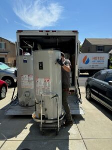 HOTCO Technician Moving Water Heaters in Newcastle, CA